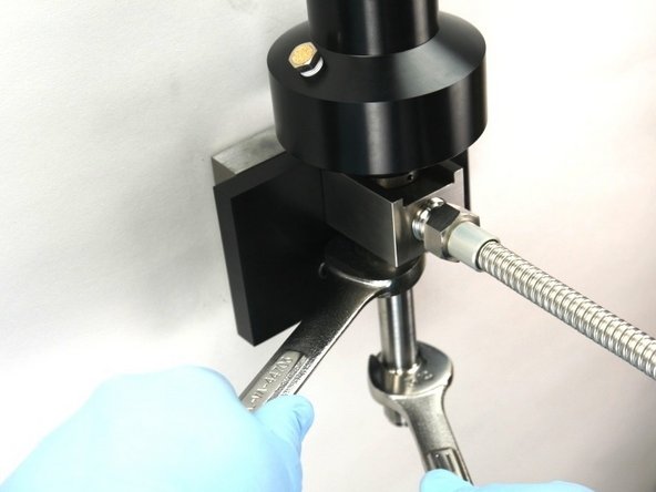 Tighten the nozzle tube to the valve body using a 3/4&quot; and 7/8&quot; wrench.