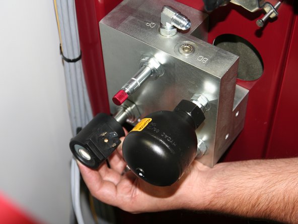 Install large 24VDC coil (removed from old manifold) onto large solenoid stem  of control manifold.