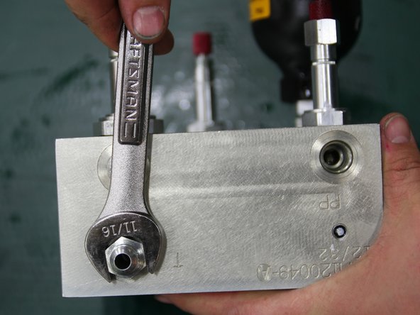 Install large 24VDC coil (removed from old manifold) onto large solenoid stem  of control manifold.