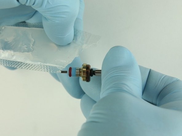 Apply the high-pressure lubricant to the outside diameter of the high-pressure valve seal.