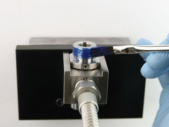 Apply  Blue Goop to the top threads of the valve body.