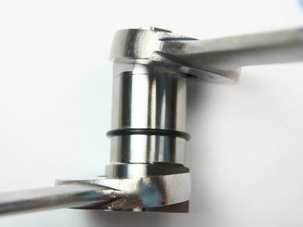 Tighten bearing half of swivel housing to seal half of swivel housing with two 1-1/8&quot; wrenches.