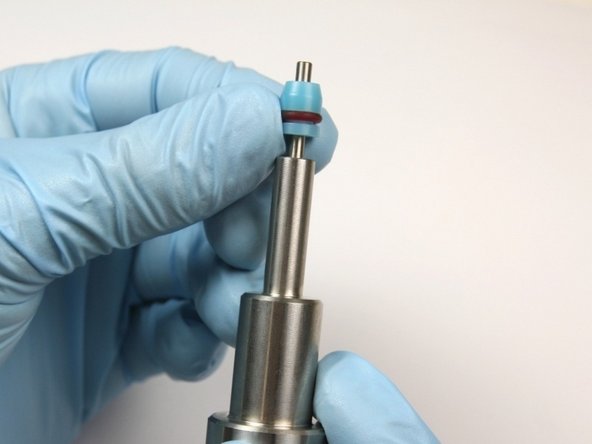Put the high-pressure seal on to the bleed-down valve tool with the O-ring towards the bleed down valve tool.