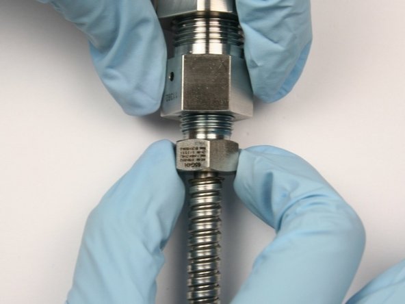 Unthread gland nut from outlet adapter