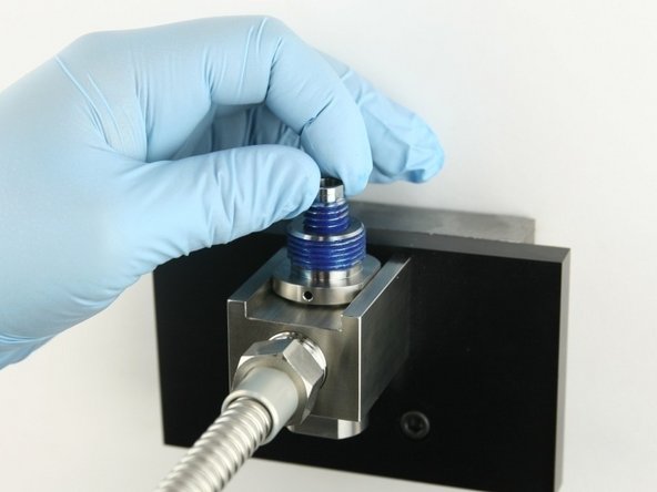 Thread the valve screw into the valve body until it bottoms out.
