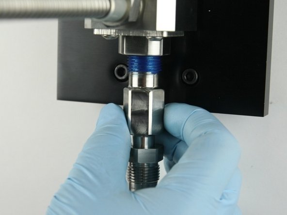 Thread the adapter into the valve body.