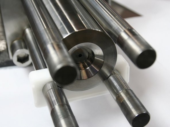 Remove seal installation spacer tool, taking care to that LP poppet stays in LP poppet basket