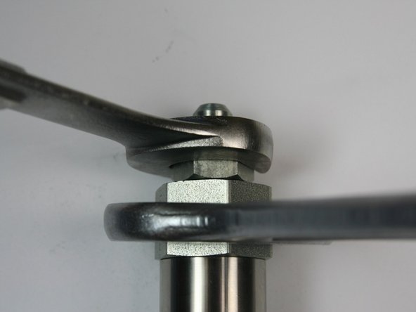 Tighten the hydraulic fitting into the adapter fitting using 1-1/4" and 7/8" wrench.