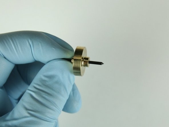 Slide the needle bearing onto the needle point with the larger stepped side pointing towards the needle point.