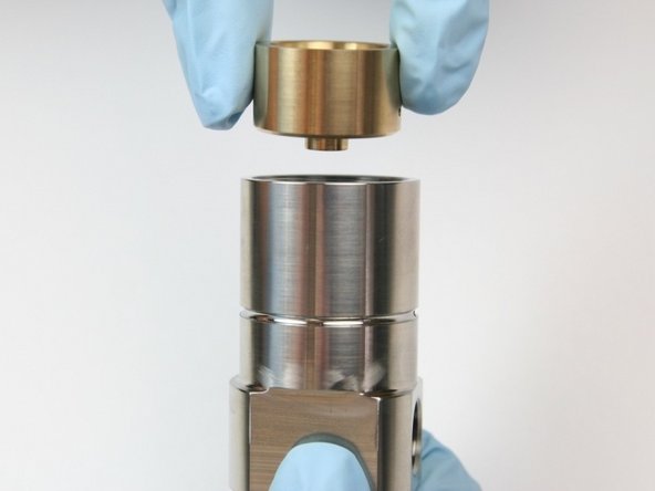 Place the back-up bearing into the seal half of the swivel housing with the small stepped end down.