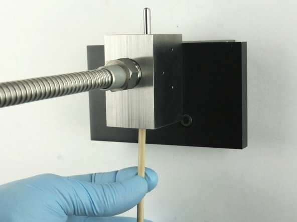 Remove all the valve components from the valve body with the included dowel.