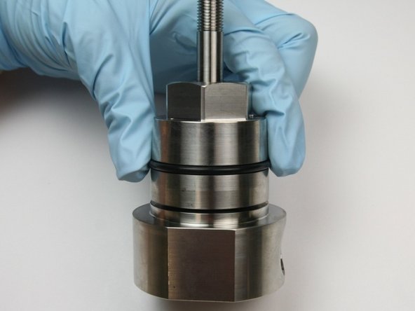 Roll a dust protecting O-ring over  the bearing half of the assembly.