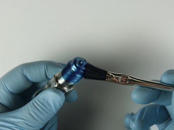 Apply Blue Goop to the top of the accu seat.