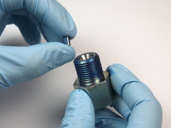 Put the flow reducer in the outlet adapter.