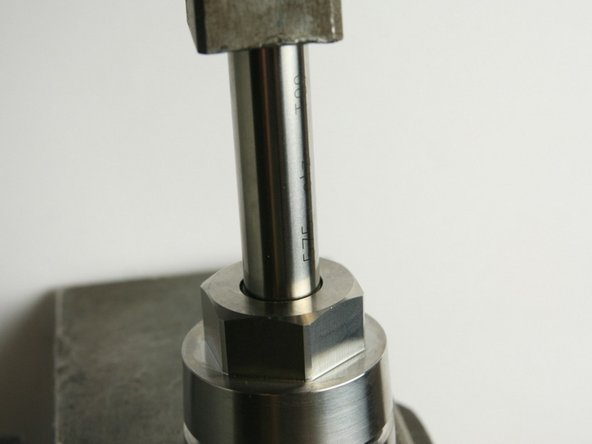 Press the swivel bearing down into the cavity using a .575&quot; gauge pin (if necessary, also use an arbor press)