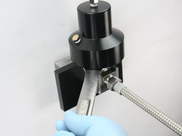 Unthread the actuator from the valve body using a 1-1/8&quot; wrench.