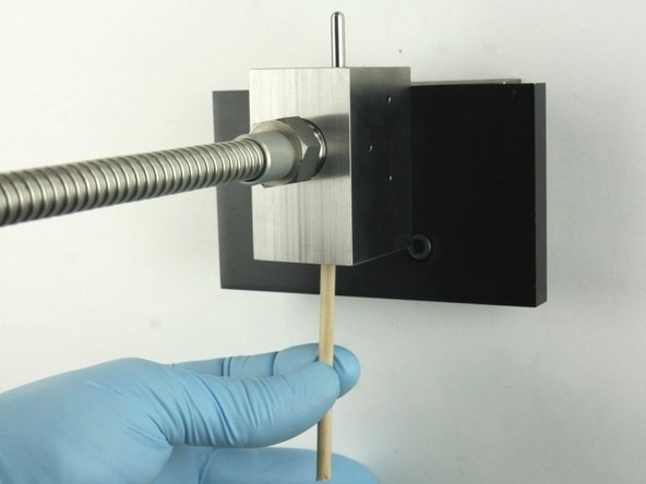 Remove all the valve components from the valve body with the included dowel.