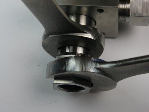 Loosen the outlet fitting from the bleed down valve body using a 7/8" and 13/16" wrench.