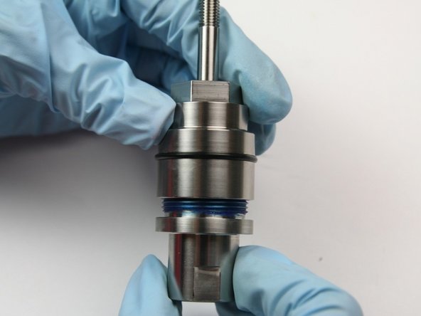 Unthread the bearing half from the seal half of the swivel housing.