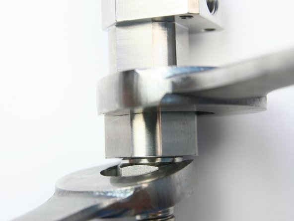 Tighten the gland nut into the bleed down valve adapter using 13/16&quot; and 5/8&quot; wrench.