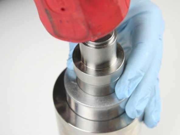 Use a rubber mallet to set the hoop into the high-pressure cylinder (until the push tool bottoms out).