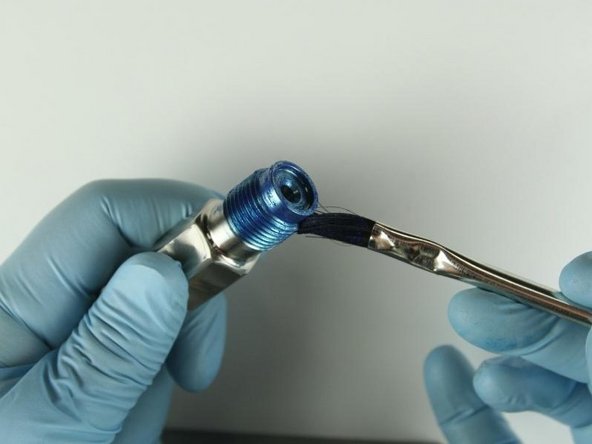 Reapply Blue Goop to the top threads and to the top of the adapter.