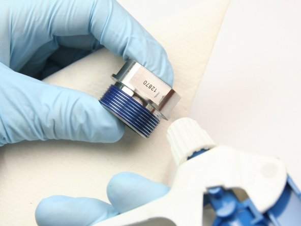 Clean all Blue Goop from the bearing half of the swivel housing with isopropyl alcohol or a similar cleaning agent.