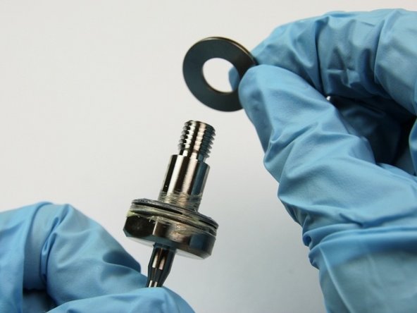 Put the second thrust washer onto the swivel shaft.