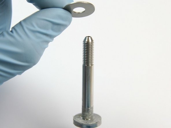 Put the first thrust washer from the kit onto the swivel shaft.