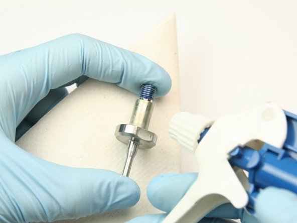 Clean the swivel of all Blue Goop and lithium grease with isopropyl alcohol or a similar cleaning agent.