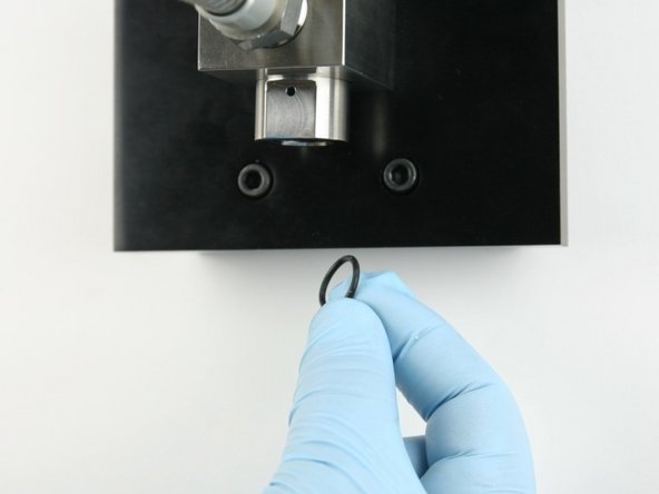 Put the O-ring behind the high-pressure seat so it will be held in place.
