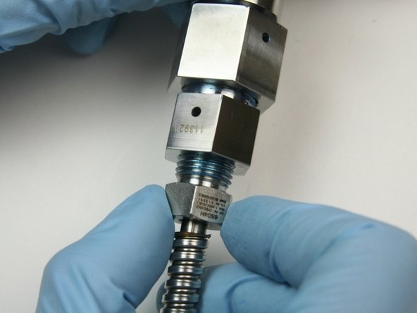 Unthread the gland nut from the outlet fitting (connected to the valve body).