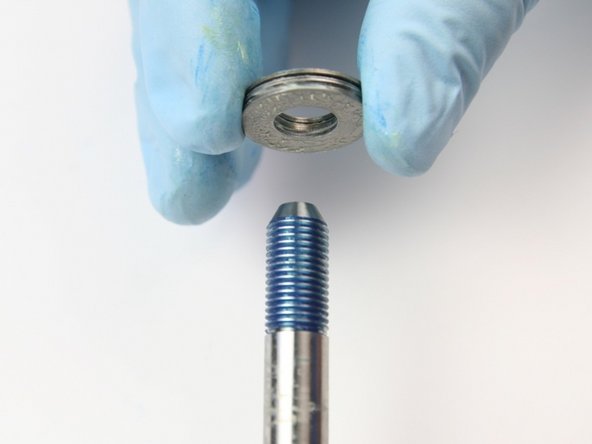 Remove the thrust bearing and the thrust washers from the swivel shaft.