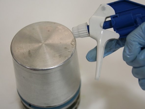 Put the piston assembly tool onto the piston to fit in the groove.