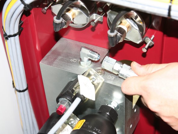 Connect hydraulic line from compensator on pump to port labeled CP on top of new manifold.