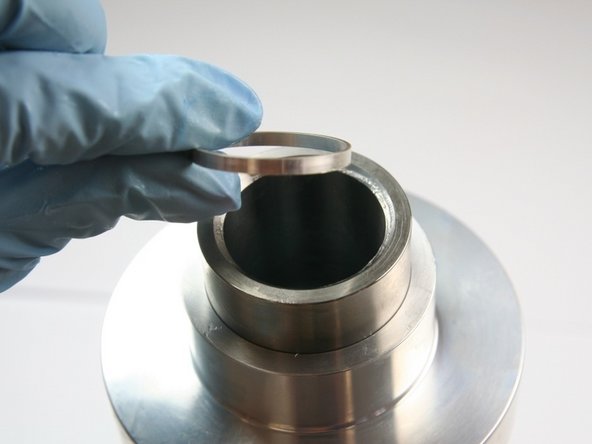 Put the hoop into the sleeve with the  sharp (tapered) end first.