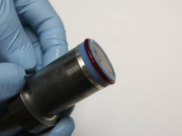 Put the seal and hoop onto the bigger stepped side of the installation tool.