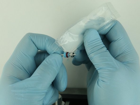 Apply a high-pressure lubricant or similar (11136) to the  outside diameter of the high-pressure valve seal.