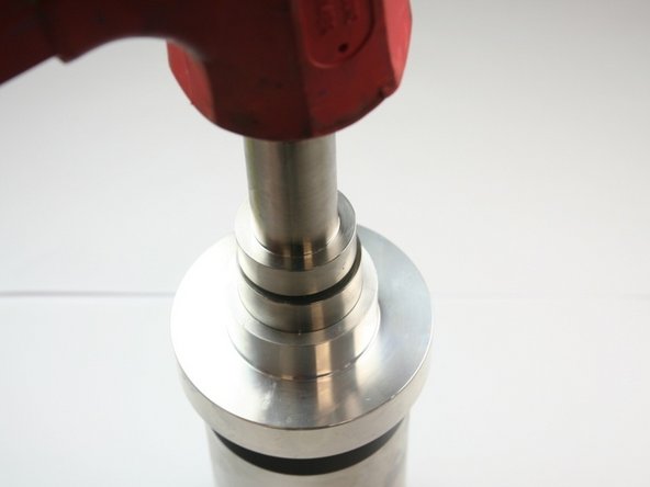 Secure hoop in place by tapping installation tool in with a rubber mallet until tool bottoms on high-pressure cylinder face