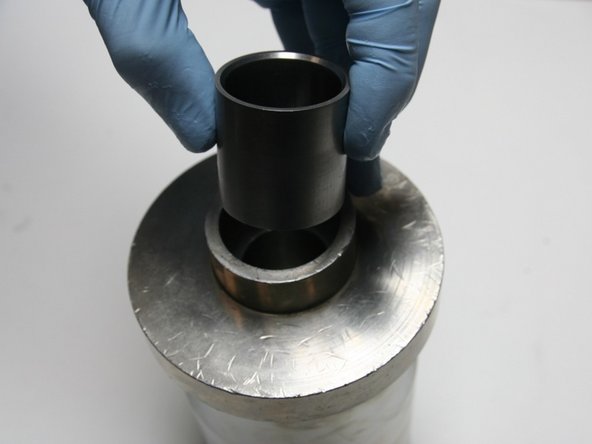 Put the installation sleeve into the sleeve guide with the larger ID, tapered end, up.