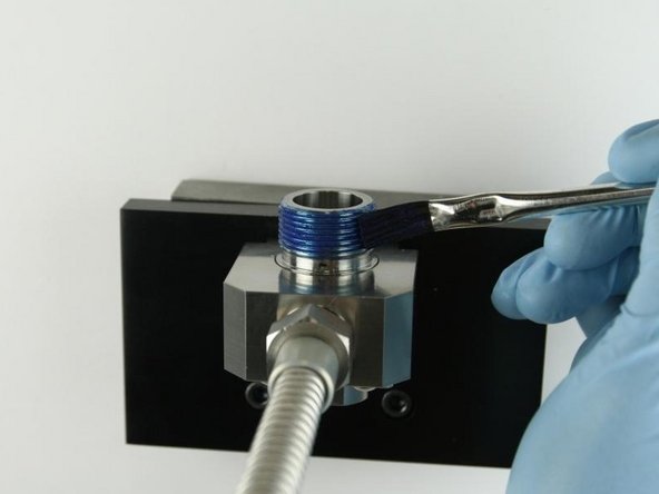 Apply Blue Goop to the top threads of the valve body.