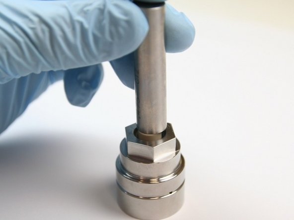 Put the bearing back-up into the seal half of the swivel housing on the top of the high-pressure seal with a .300-.360 gauge pin until it bottoms out.