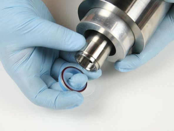 Remove the hoop and high-pressure seal assembly from the high-pressure cylinder.