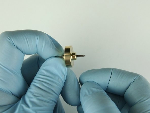 Slide the needle bearing onto the needle point with the smaller stepped side away from the needle point.