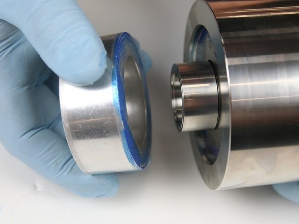 Remove the locator tool from the high-pressure cylinder.