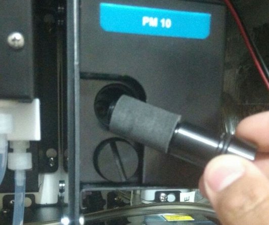 Unscrew the top sample inlet filter from the side of the optical engine.