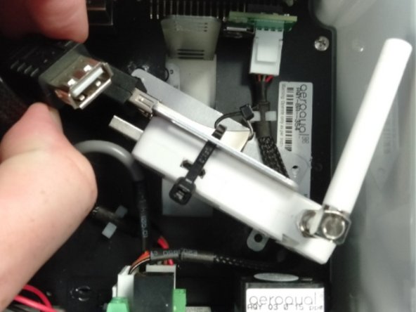 Insert the flash drive into any of the USB ports on the monitor's embedded PC (ePC).