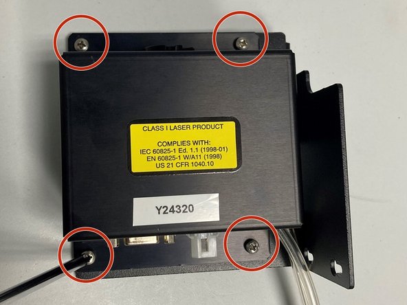 Using a large Philips screwdriver, remove the four screws holding the module to the mounting bracket