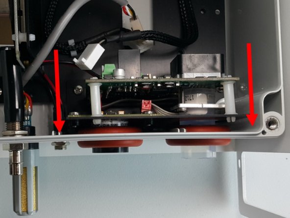 Align the NO2 and O3 sensors with the appropriate holes in the base and push the sensor board into position.