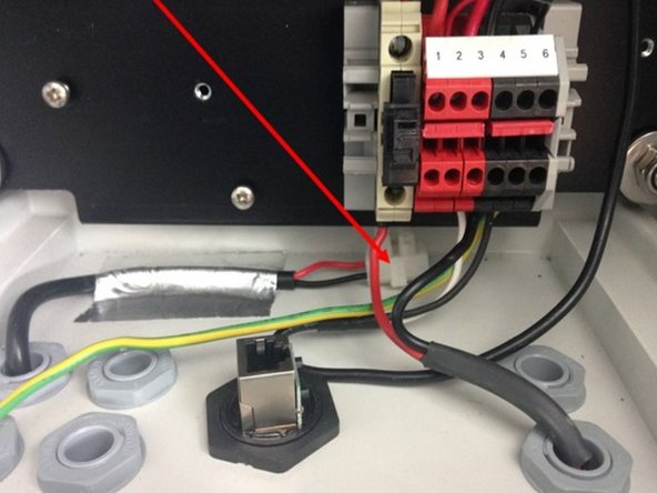 Find the 12 VDC mains cable enters the monitor through a gland in the floor.
